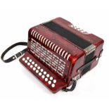 Twenty-one button melodeon, red pearloid finish