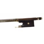 Silver mounted violin bow faintly stamped Vuillaume, the stick round, the ebony frog inlaid with