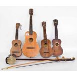 Four various ukuleles in need of restoration, including one labelled Juan Gomez, a USA made Harmony,