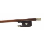 Violin bow stamped Louis Bazin, the stick round, the ebony frog inlaid with pearl eyes and with a