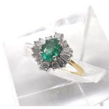 18ct emerald and diamond cluster ring, the oval emerald 0.65ct approx, in a surround of round