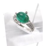18ct white gold emerald and diamond dress ring, the oval emerald cabouchon in a surround of four