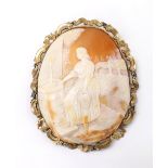 Large gold mounted oval shell cameo brooch depicting Rebekah at the well, circa 1870, 100mm x 80mm