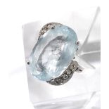 18ct white gold aquamarine dress ring, in a swirl setting with diamond set shoulders, 7.2gm, the