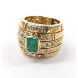 Fancy 18ct emerald and diamond band dress ring, the emerald 1.41ct approx, in a layered brick design