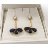 Attractive pair of 18ct sapphire and diamond drop earrings, each with single pear shaped diamonds