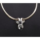 18ct white gold diamond pendant on a slender necklet, the pendant with three round brilliant-cut