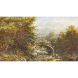 J*E* Webb (19th century) - river landscape with an angler on a stone bridge, indistinctly signed,