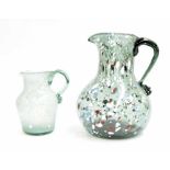 Two Nailsea mottled glass jugs with speckled decoration, 6.25" and 10" high respectively (2)