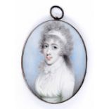 Miniature School (19th century) - gold mounted oval portrait pendant depicting a lady, with a