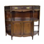 Edwardian mahogany canted side cabinet, with a central drawer upon ring turned supports over