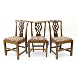 Set of three early 19th century small oak dining chairs, the shaped cresting rails over pierced vase