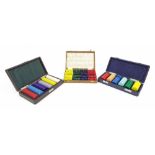 Three cased sets of gaming counters (3)