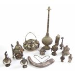 Collection of Eastern and Bedouin white metal scent bottles, engraved and some set with coloured