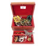 Assorted costume jewellery within a tiered leather jewellery box