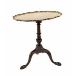 19th century mahogany tripod table, the oval moulded piecrust later top upon a turned carved