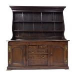 Antique oak dresser, with shelved back over base of two short over three long graduated drawers with