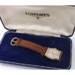 Longines 14k yellow gold gentleman's wristwatch, circa 1947, tonneau silvered dial with applied