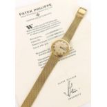 Patek Philippe 'IOS Million Dollar Associate' Calatrava 18ct automatic gentleman's bracelet watch,