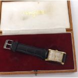 Fine Longines 14k hourglass curved gentleman's wristwatch, circa 1950, rectangular silvered dial