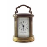 Matthew Norman miniature oval carriage clock timepiece, 4.5" high (key)