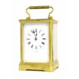 French carriage clock striking on a gong, within a corniche gilded brass case, 7" high (key)
