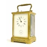 Repeater alarm carriage clock, the movement back plate bearing the trademark logo of Dejardin and