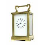 Brass carriage clock timepiece, within a corniche style case with fluted pilasters, 6" high (key)