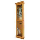 Magneta electric master clock, within a light oak glazed case, 55.25" high (pendulum)