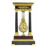 Fine French Empire bronze and ormolu portico two train swinging pendulum mantel clock, the 3.5"