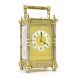 Large French repeater carriage clock striking on a gong, the 2.25" cream dial within a gilt mask and