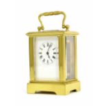 Miniature carriage clock timepiece, within a corniche style brass case, 3.75" high