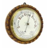 Circular aneroid wall barometer, the 8" cream dial within a rope twist surround