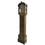 Carved oak case with aperture for a 12" arched dial, the long door carved with a vase of flowers,