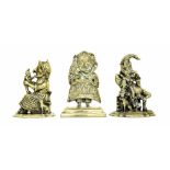 Three various cast brass doorstops, modelled as Mr and Mrs Punch, the tallest 11.75" high (3)