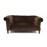 Victorian Chesterfield drop-end settee, in a brown corded upholstery upon turned feet, 70" wide, 38"