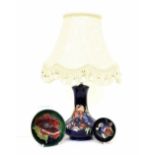 Moorcroft 'Anemone' table lamp and shade, decorated on a blue ground, the base 8" high; together