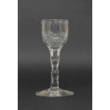 George III wine glass, the ovoid fluted bowl on a facet cut stem and circular foot, 5.25" high