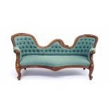 Replica double ended chaise longue in the Victorian style, with carved frame and button-back green