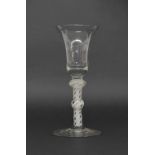 18th century cordial glass, the bell shaped bowl on an opaque double knop stem and circular foot,