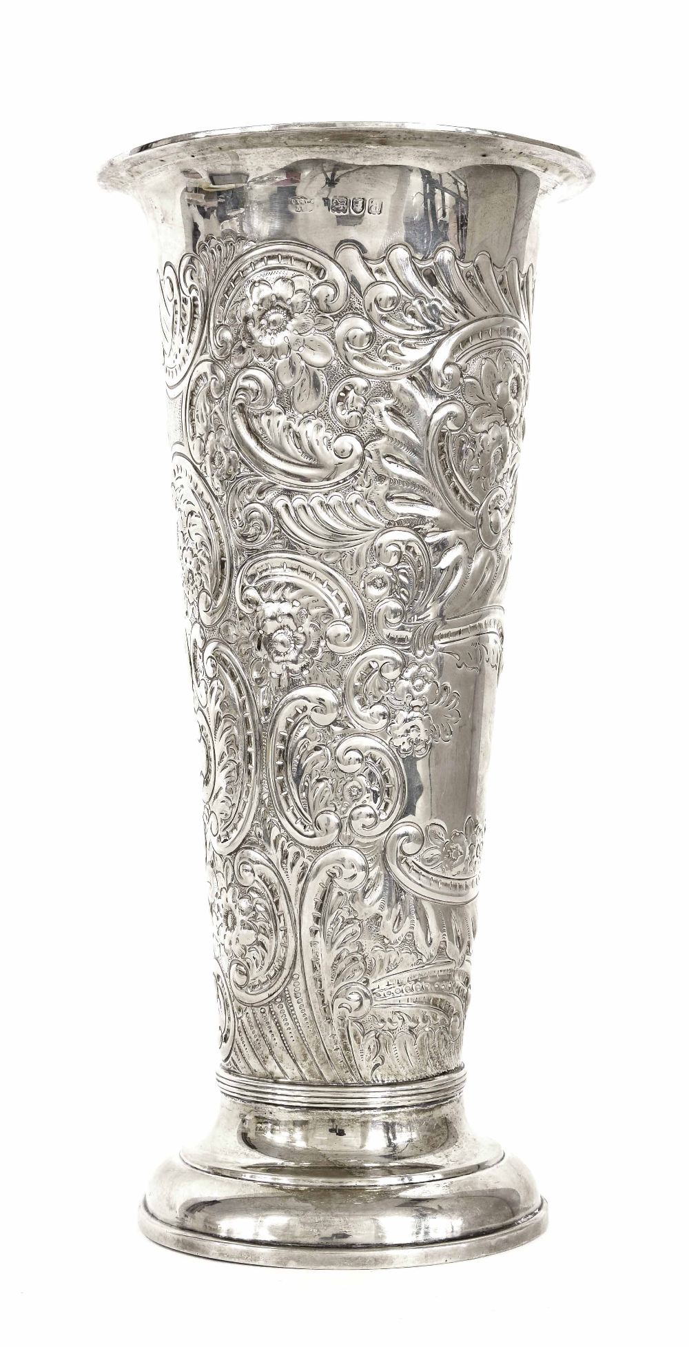 Large late Victorian silver vase, of cylindrical tapered form repousse with foliate decoration,