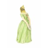 Royal Worcester porcelain candle snuffer of Jenny Lind, modelled wearing a long green dress with a
