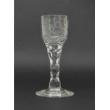 18th century cordial glass, the ogee bowl engraved with flowers and a bird on a facet cut stem and