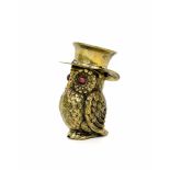 Novelty brass vesta case in the form of an owl with glass inset eyes, modelled wearing a top hat,