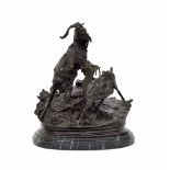 Reproduction bronze group modelled with two goats on a naturalistic base and oval marble socle, 11.