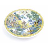 19th century Istoriato style Maiolica circular shallow charger, decorated with figures and animals