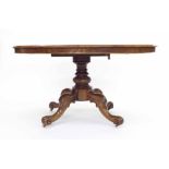 Victorian walnut loo pedestal table, the oval canted top supported upon a turned column and four