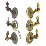 Set of six decorative Italian style painted wooden wall brackets with scrolling arms and acorn