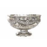 Good Late Victorian silver punch bowl, the half reeded body repousse with a foliate garland, maker
