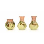 Pair of small Burmese glass vases with fruiting vine decoration, 4" high; together with a similar